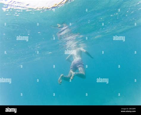 Person Floating Underwater