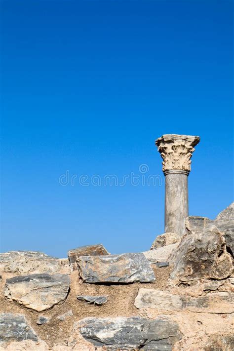 Ruins Of Ancient Temple Top Of The Column Against Blue Sky Stock