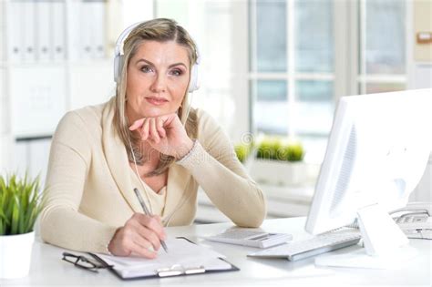 Portrait Of A Mature Woman Using Computer Stock Photo Image Of