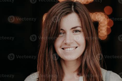 Happy Brunette Smiling Woman With Dark Hair White Teeth Looks