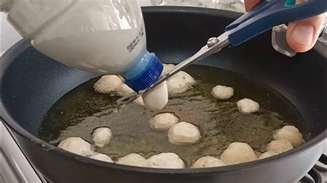 Someone Is Using An Electric Device To Stir Food In A Pan