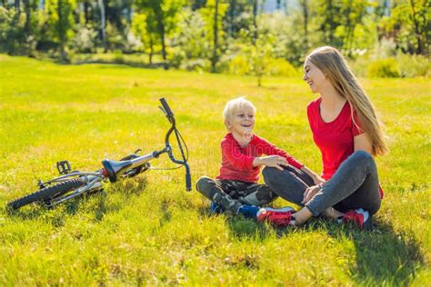 Mom And Son Rest On The Lawn After Riding A Bike Banner Long Format Stock Image Image Of Full