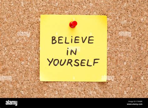 Believe In Yourself Written On An Yellow Sticky Note On A Cork