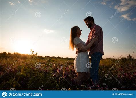 Embracing Couple In Rays Of Setting Sun Stock Photo Image Of