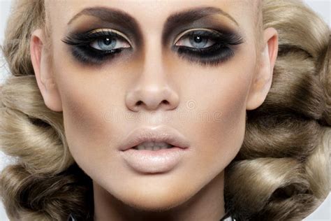 Closeup Front Portrait Of Blonde Woman With Artistic Hairstyle And Makeup Dramatic Look Smokey