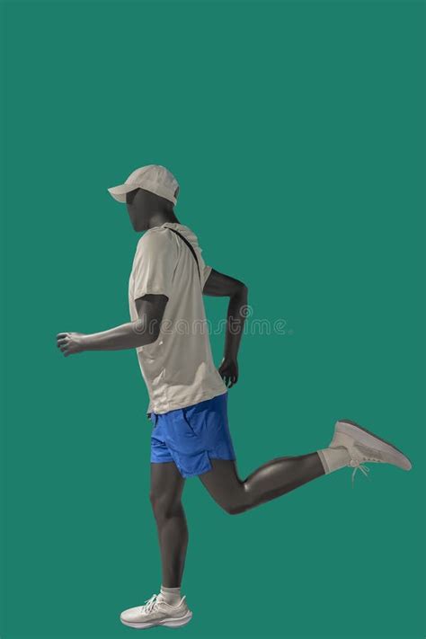 Running Male Athlete With Muscular Naked Torso Wearing Shorts On Blue Studio Background Long