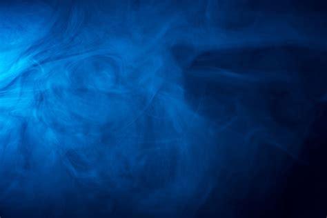 Premium Photo Blue Smoke Texture On Black Background