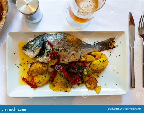 Grilled Gilthead Bream Dorada Served At Plate With Garnish Stock Photo