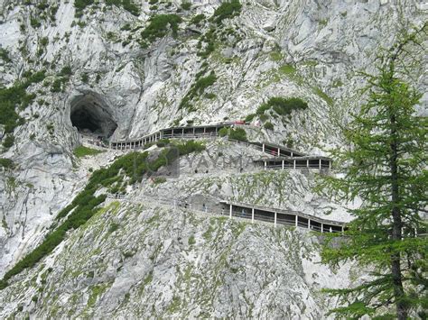 Path and entrance to Eisriesenwelt ice cave in Austrian Alps by slavapolo Vectors ...