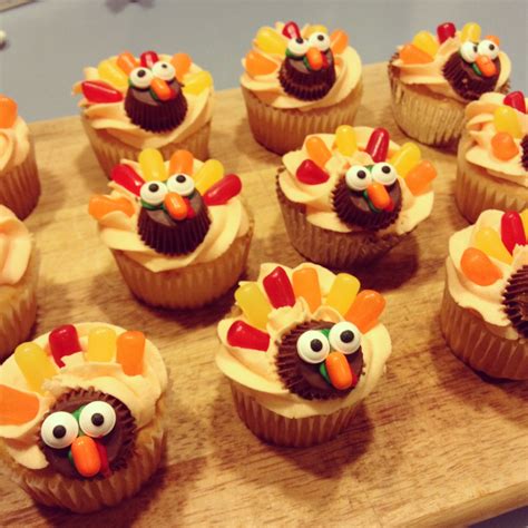 Cupcakes Decorated Like Turkeys On A Wooden Board