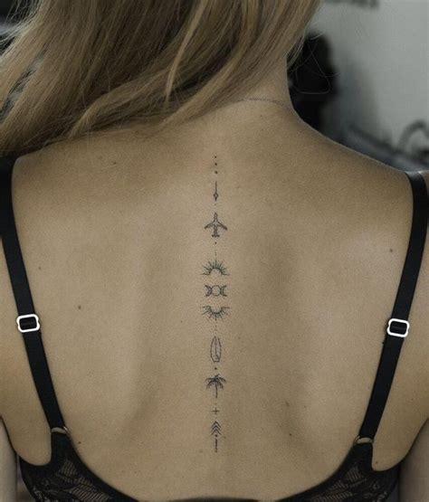 The Back Of A Woman S Neck With Arrows And Stars On Her Left Side