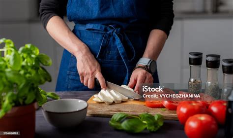 Preparing Caprese Salad Womans Hands Cutting Mozzarella Cheese On Board