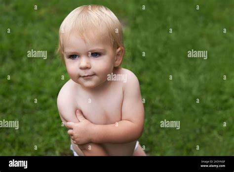 Taking In The Outdoors From A Childs Perspective A Baby In His Nappy
