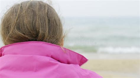 Close Up Of A Girl Sitting On The Seashore From The Back Stock Video
