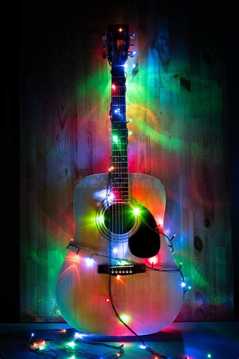 Classic Acoustic Guitar in Christmas Lights Stock Photo - Image of christmas, bright: 150885852