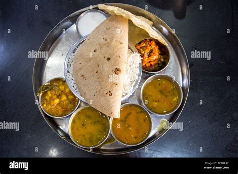 Preparing and selling Indian street food in a food stall. Photographed ...