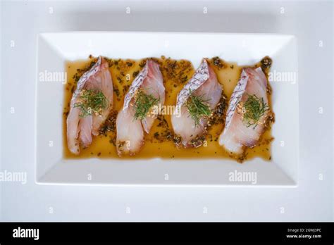 Sea Bass Sashimi With The Sauce On White Plate On White Background Isolated On White Japanese