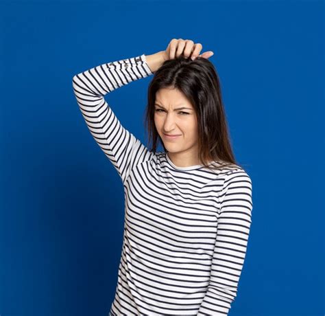 Premium Photo Brunette Young Woman Wearing A Striped T Shirt