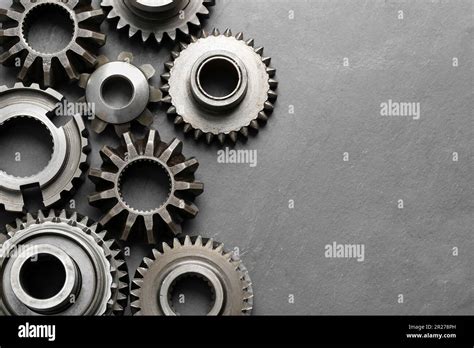 Different Stainless Steel Gears On Light Grey Background Flat Lay