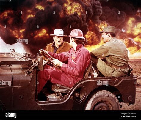 HELLFIGHTERS (1968) JOHN WAYNE, JIM HUTTON HELF 001 CP Stock Photo - Alamy