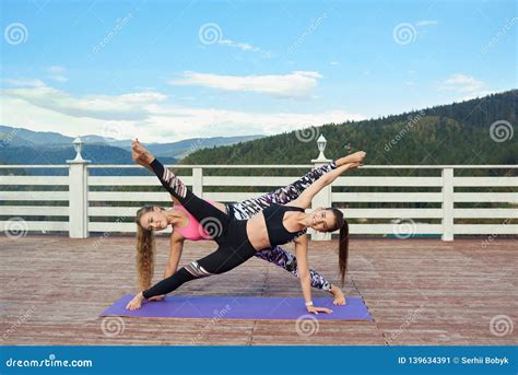 Slender Women Stretching Together On Yoga Mats Stock Image Image Of Female Healthy 139634391