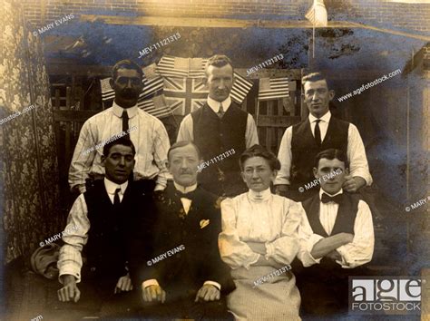 Group of seven people with British and American flags, North America ...