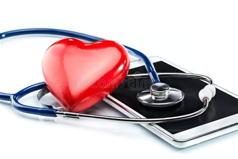 Stethoscope In The Shape Heart And Of A Heart Beat On A EKG Stock Photo