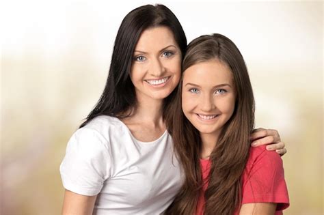 Premium Photo Mother And Teen Daughter Smiling At Camera