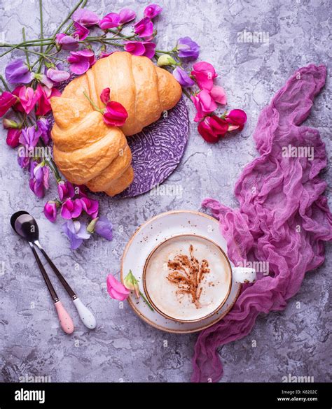 Coffee, croissants and flower Stock Photo - Alamy