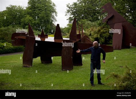 British Artist Jake Chapman Poses For Photographs With His And His