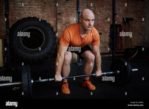 Fit Man Lifting Barbell Stock Photo Alamy