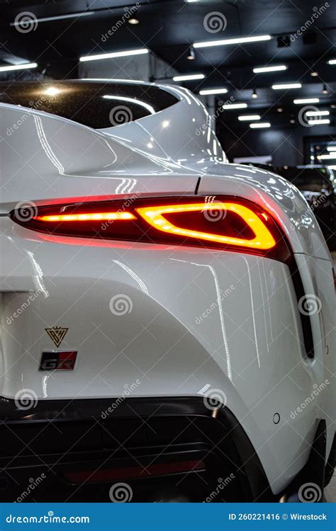 Vertical Shot Of The Rear Part Of A White Toyota Supra A90 With An
