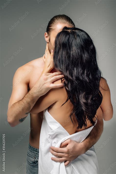 Passionate Nude Couple Hugging And Kissing In Sheets Isolated On Grey Stock Photo Adobe Stock