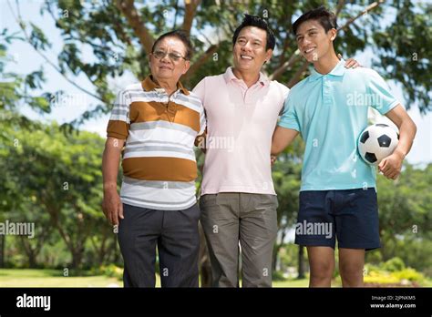 Hugging Happy Mature Man Hugging His Father And Son Stock Photo Alamy