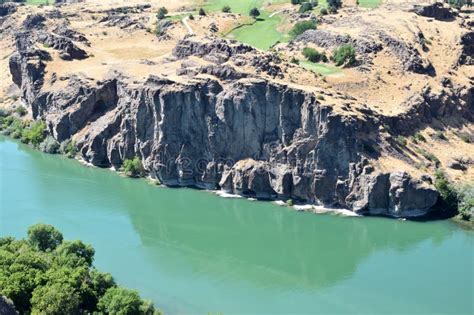 snake river cutting   rugged gorge framed  majestic rocky
