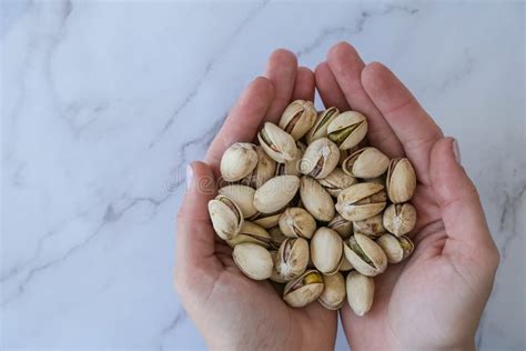 Woman Hands Holding Pistachio In Shell Nuts Healthy Food And Snack