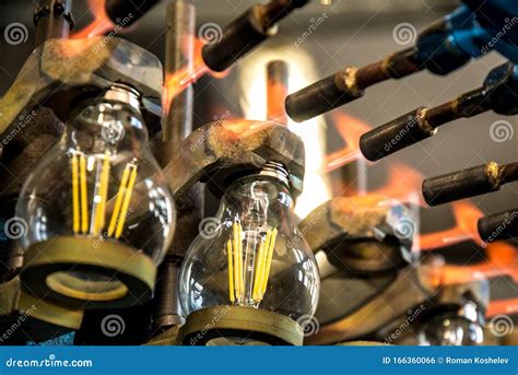 Lamp Production At The Factory Manufacturing Process Stock Photo