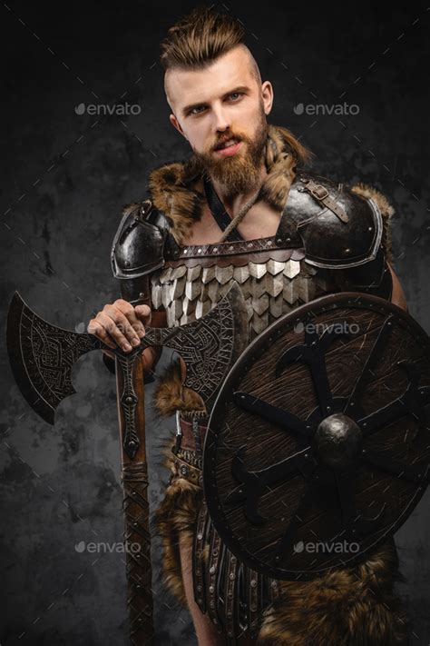 Bearded Viking Warrior Dressed In Fur And Light Armor Stock Photo By