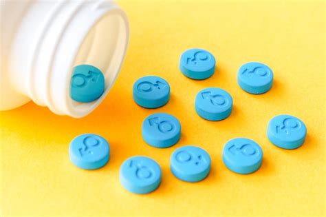 Premium Photo Blue Pills With Male Gender Symbol On A Yellow