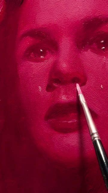 A Woman S Face Is Painted With Pink Paint