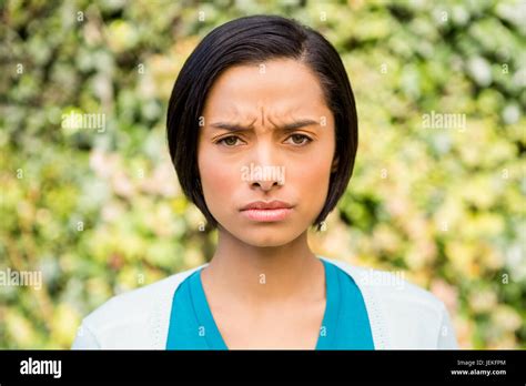 Portrait Of Frowning Brunette Stock Photo Alamy