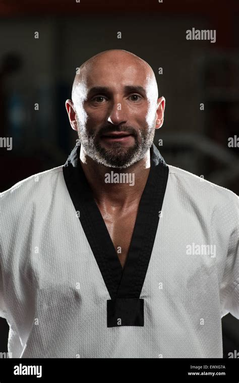 Portrait Of A Physically Fit Mature Man In Kimono With Black Belt Stock