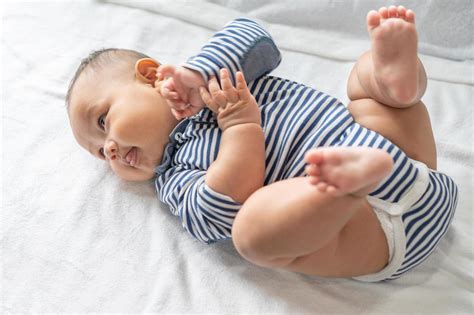 Portrait Of A Baby Lying On Back Stock Photo At Vecteezy