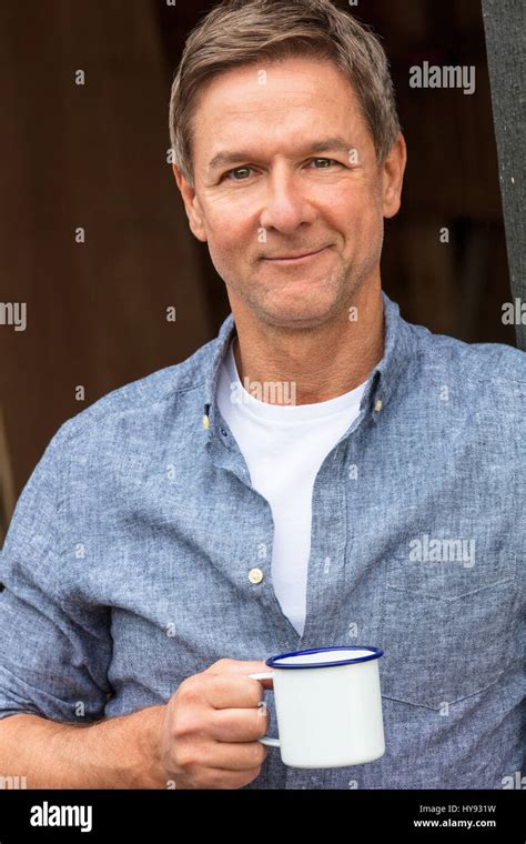 Portrait Shot Of An Attractive Successful And Happy Middle Aged Man