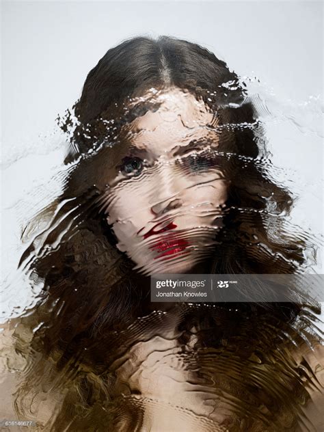 Distorted Image Of Female Shot Through Wet Glass Distorted Images