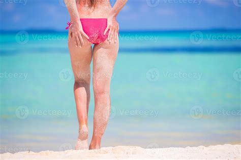 Rear View Of Beautiful Woman In Red Bikini During Beach Vacation