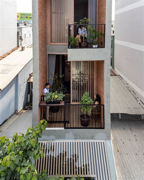 Story Architecture Fronts Narrow Vietnam House With Stacked Terraces