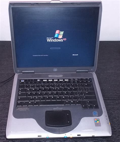 Starý notebook HP Compaq nx9010 štítek Windows XP Aukro