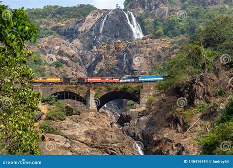 Train on the Railway Bridge on the Background of the Dudhsagar Falls ...