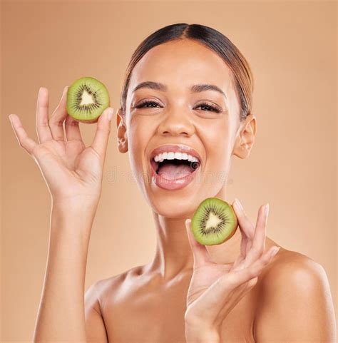 Skincare Kiwi And Portrait Of Woman With Smile In Studio For Wellness